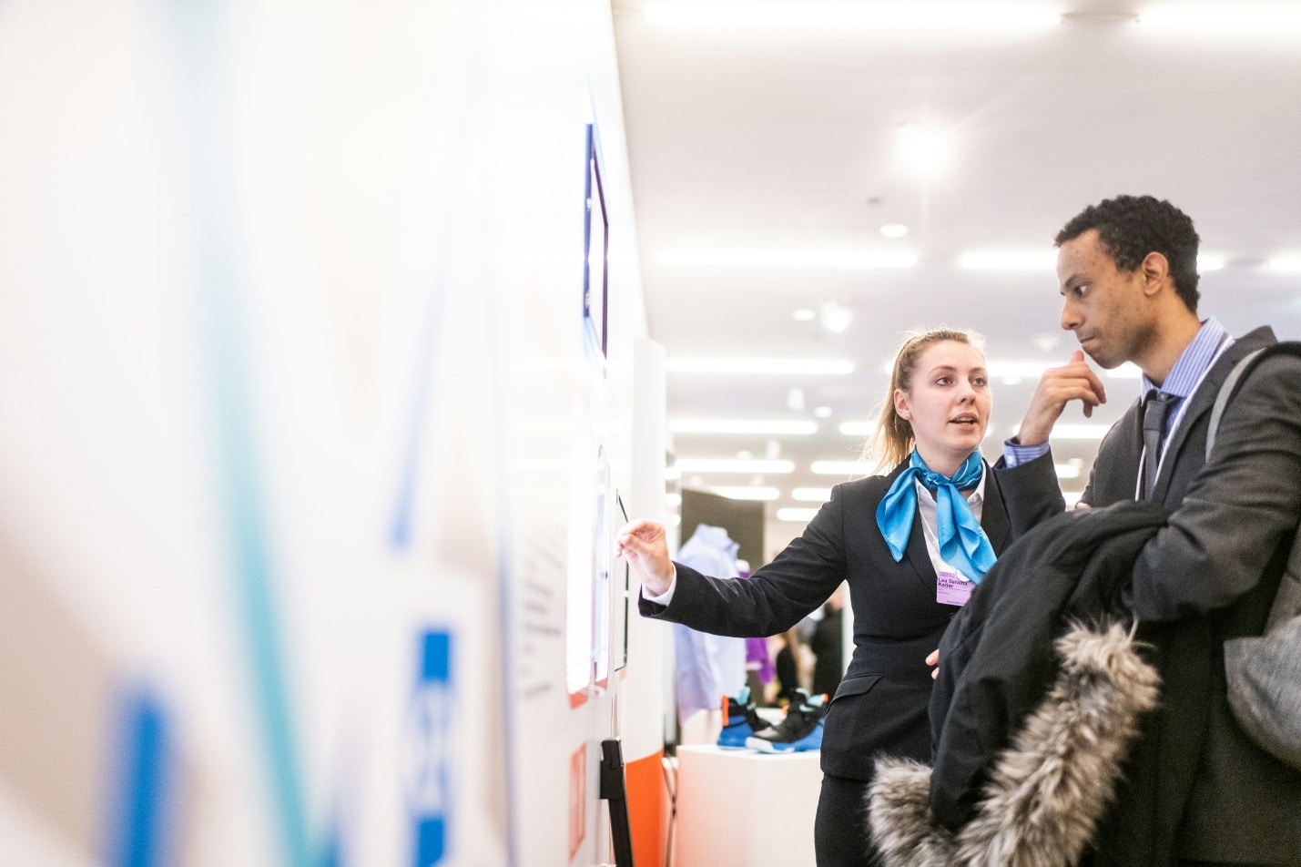 Two professionals discussing at a business event