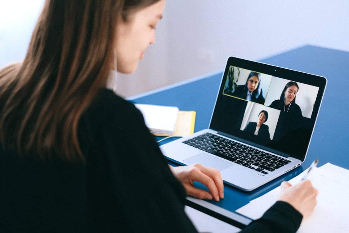 Woman attending a virtual business meeting.