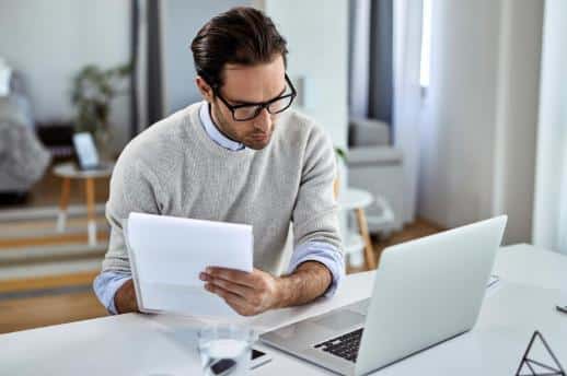 a man reviewing personal documents.