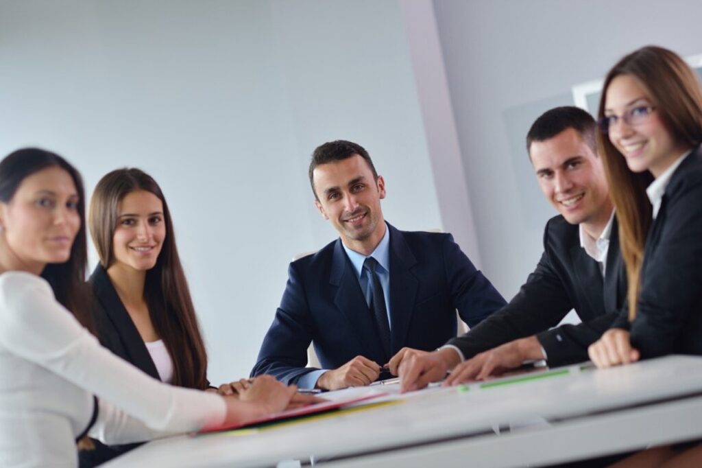 a group of people in a workspace.